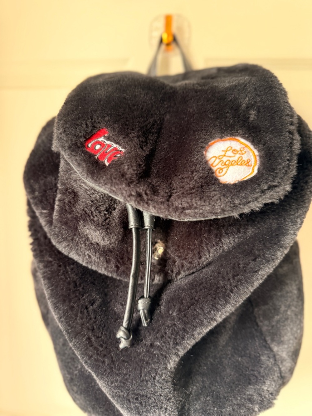 Plush Black Faux-Fur Backpack with Embroidered Accents